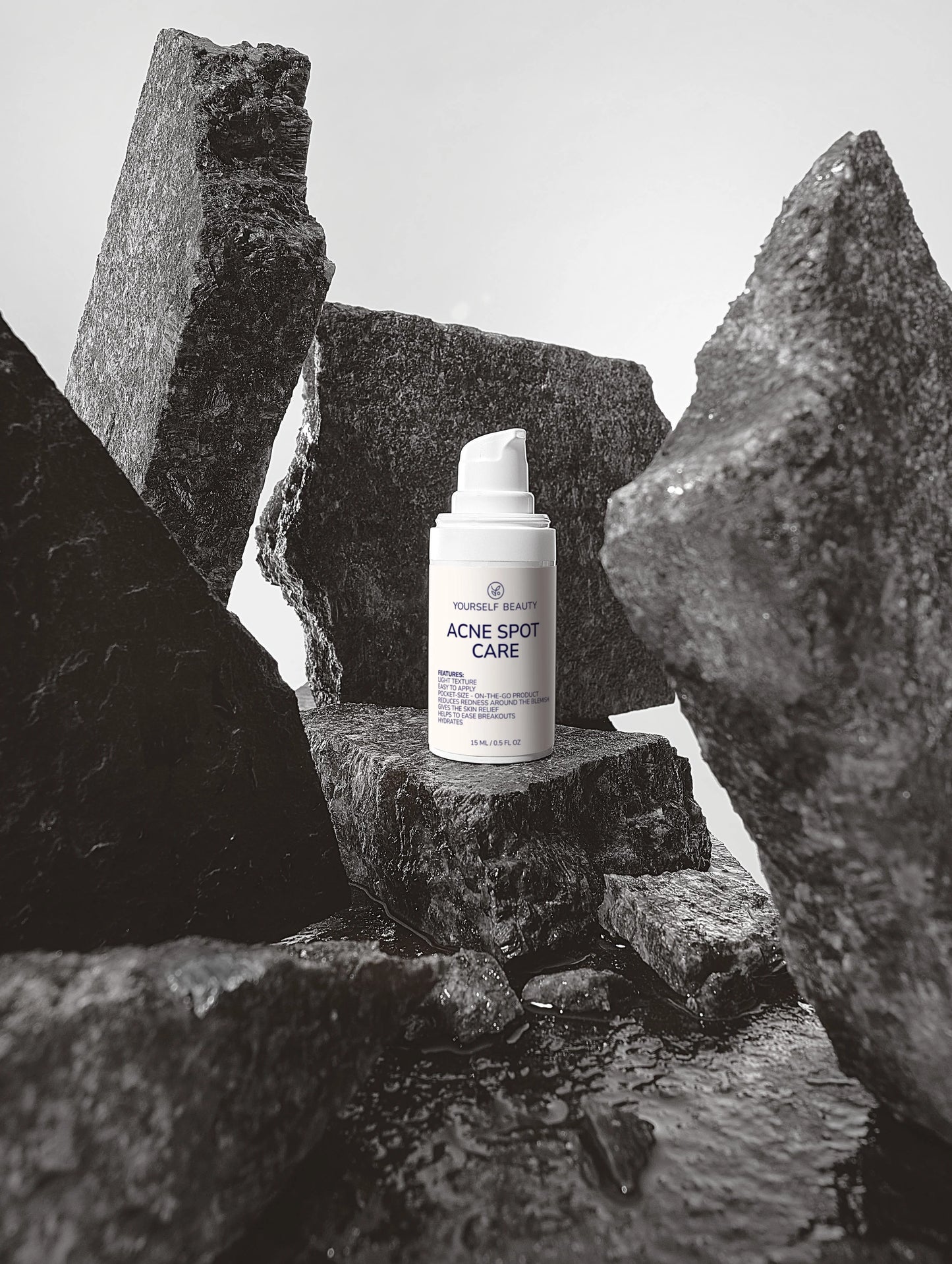 Yourself Beauty Acne spot care product on a stone surface with a minimal background.