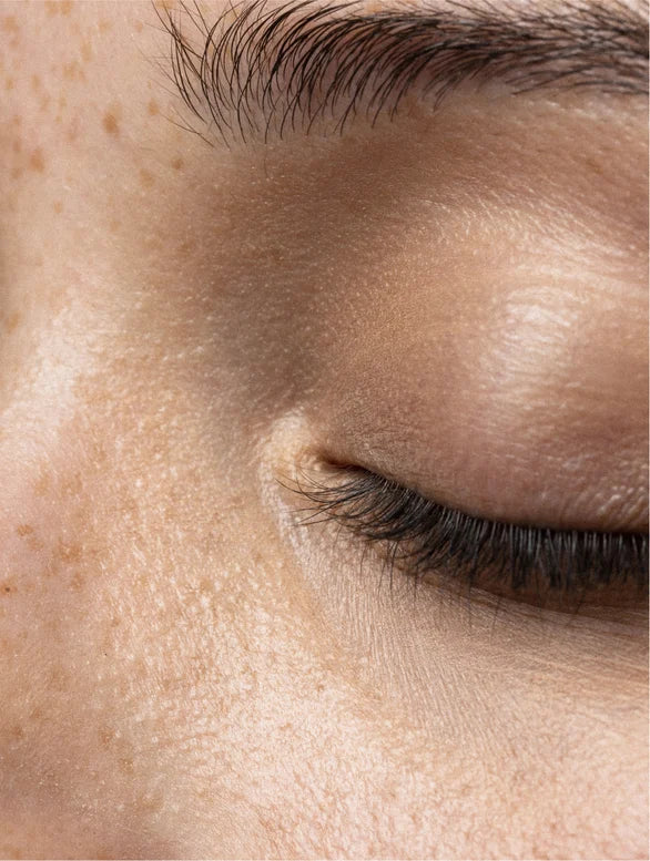 Close-up on closed woman eye.