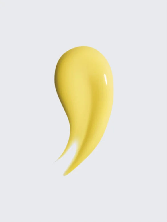 Vitamin C serum yellow texture close-up on white background.