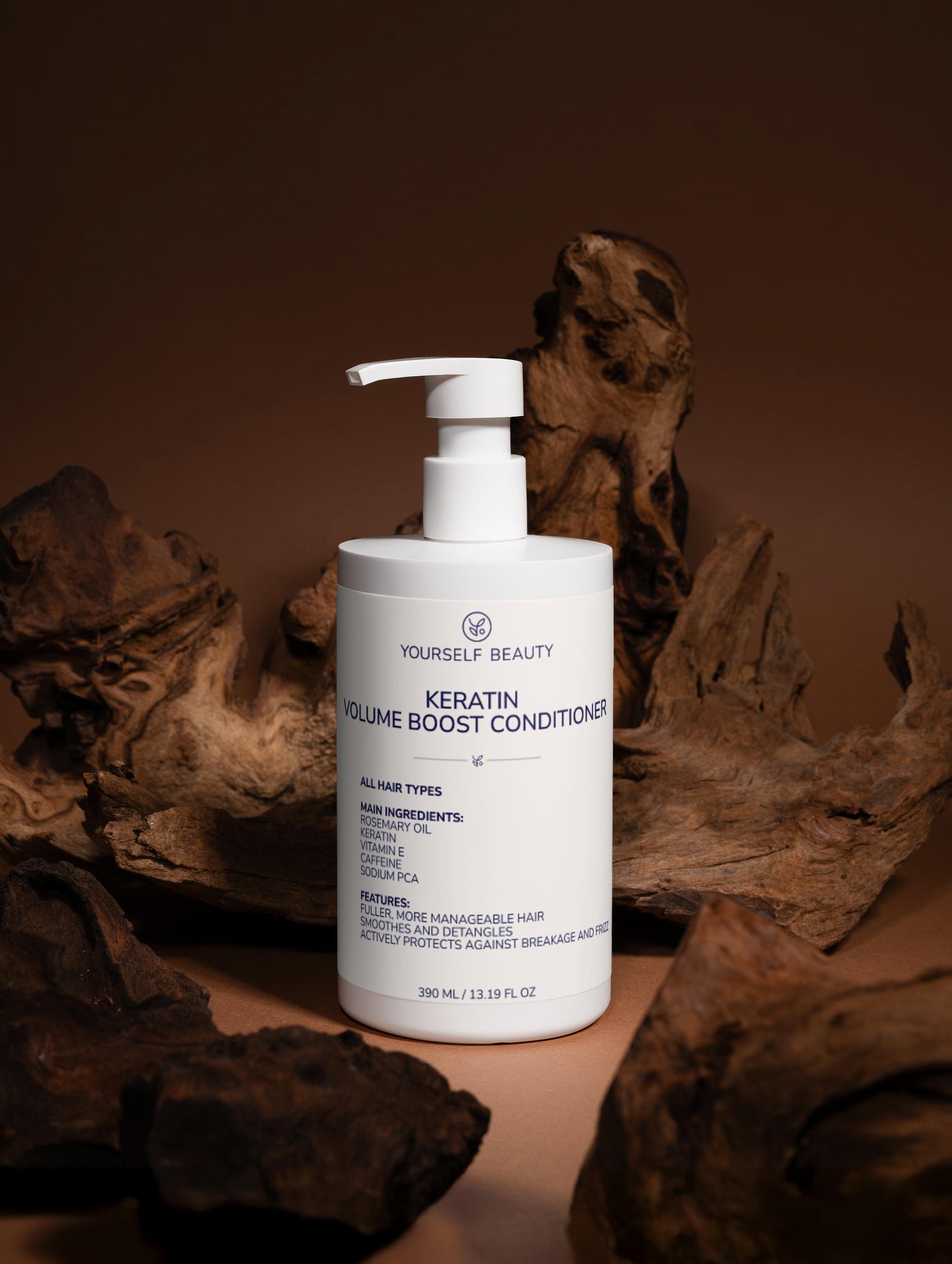 Yourself Beauty Keratin Volume Boost Conditioner bottle with pump on a brown background