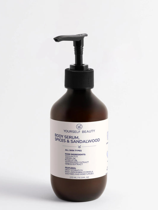 Brown bottle of body serum with a pump on a white background.