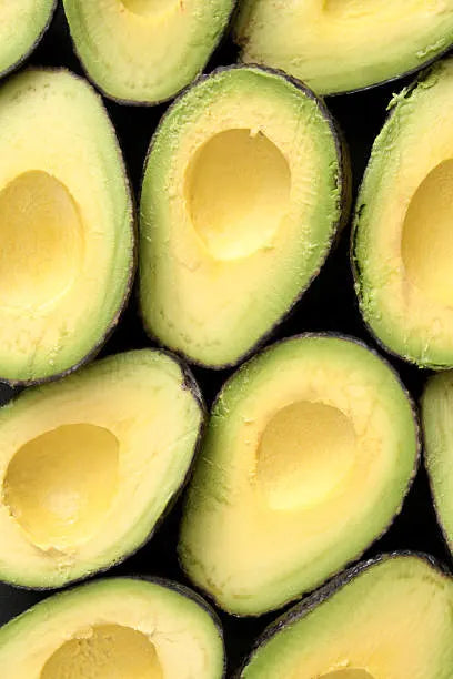 Close-up of sliced avocados arranged in a pattern.