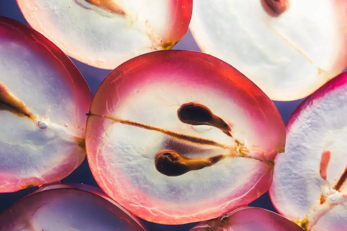 Sliced red grapes with seeds close-up.