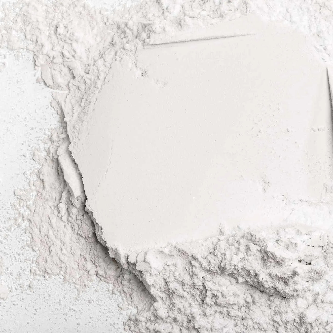 Close-up of a white powder on a white surface.