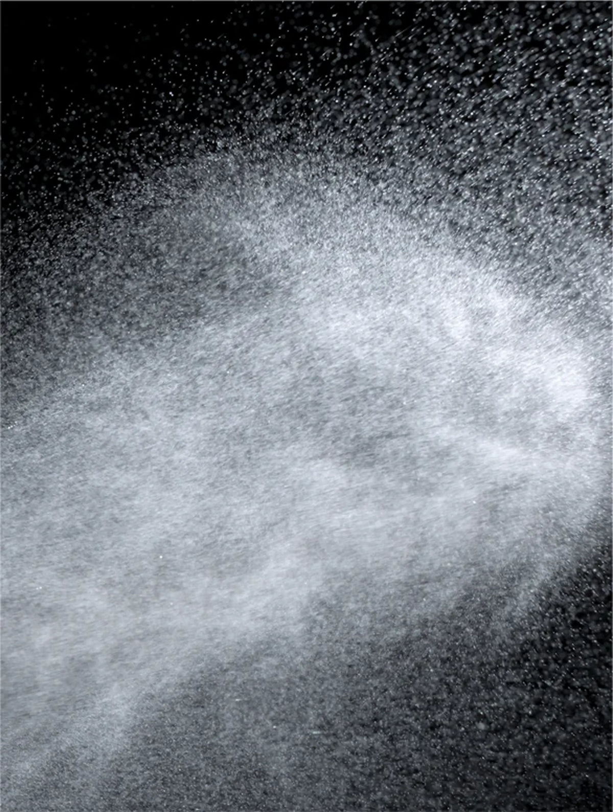 Spray close-up on black background.