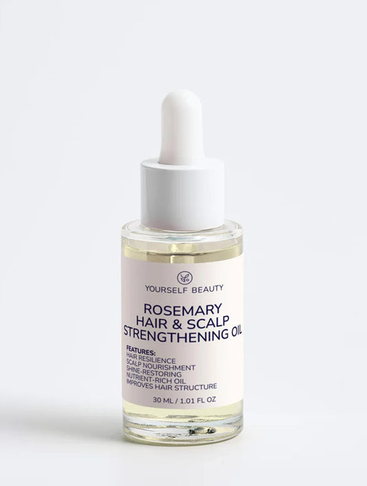 Rosemary hair and scalp strengthening oil bottle on a white background.